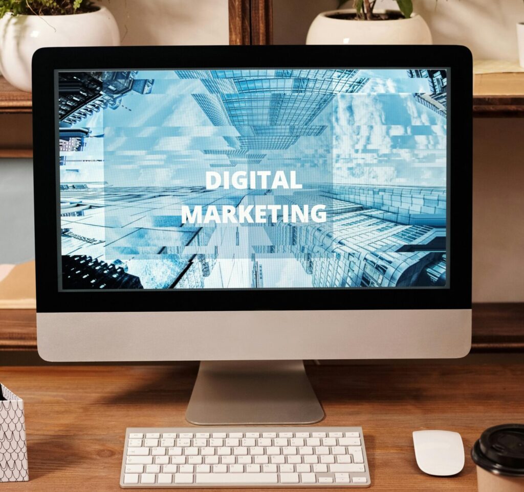 Contemporary office setup featuring digital marketing strategy on a computer screen, ideal for business technology themes.